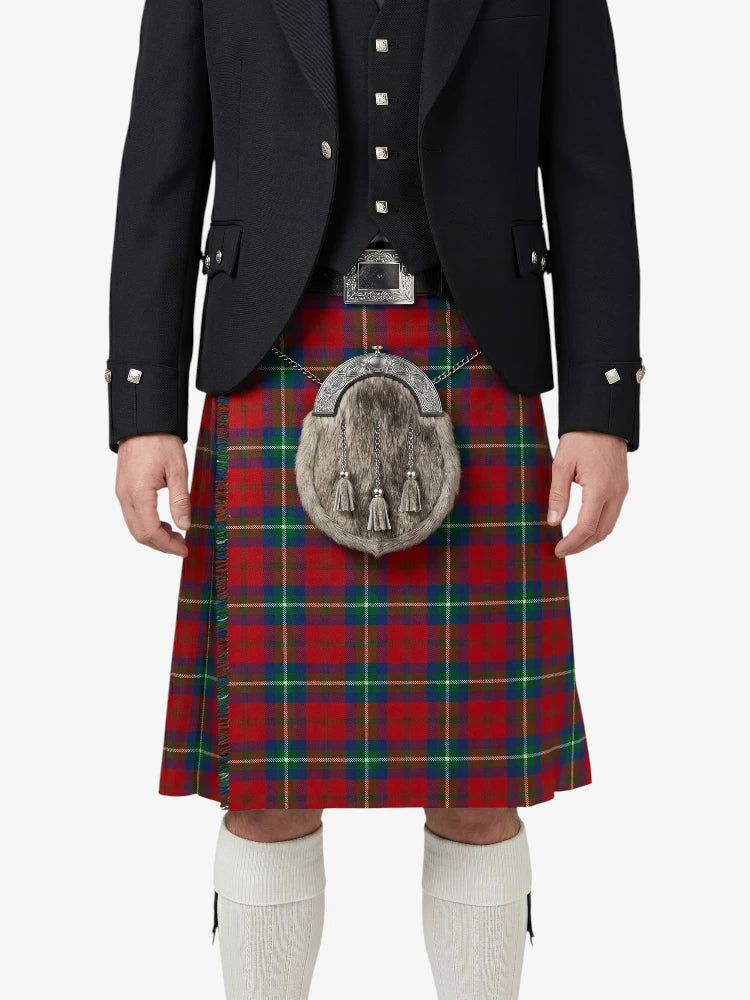 Person wearing a black jacket, red plaid kilt, and white socks on a white background