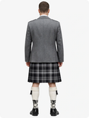 Person wearing a gray blazer and plaid kilt on a white background