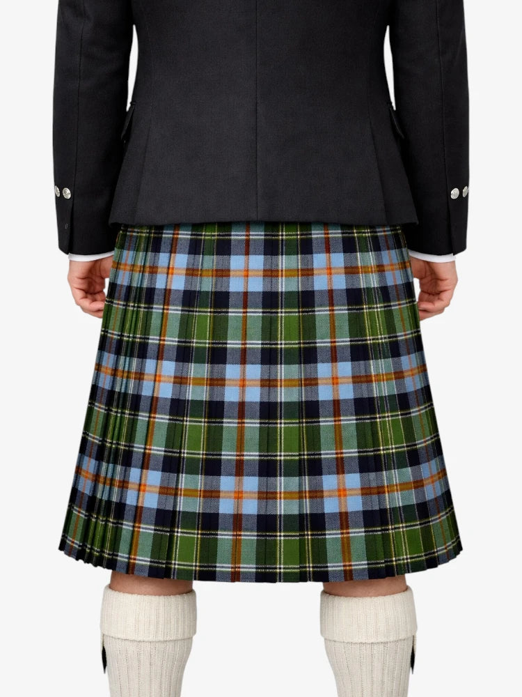 Person wearing a black jacket and green plaid kilt on a white background