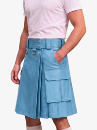 A person wearing a light blue pleated kilt-style skirt with a matching belt, metal ring details, and large front cargo pockets, paired with a pale pink T-shirt against a plain light background.