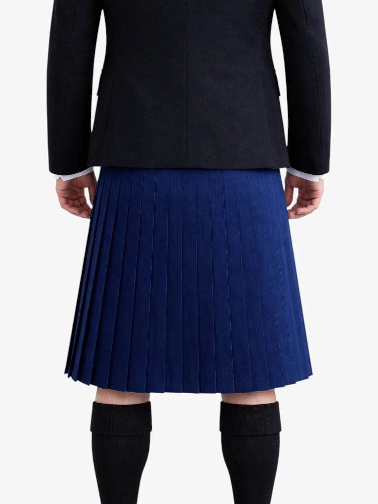 Person wearing a black jacket and blue pleated kilt on a white background