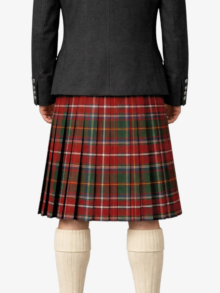 Person wearing a black coat and red plaid kilt on a white background