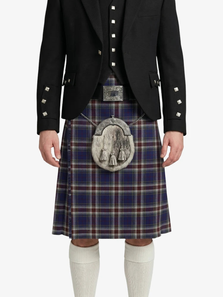 Person wearing a black jacket and plaid kilt with a silver sporran on a white background