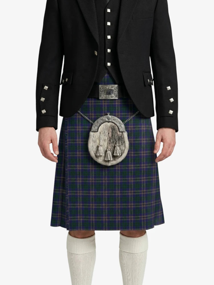 Person wearing a traditional Scottish kilt with a dark jacket on a white background