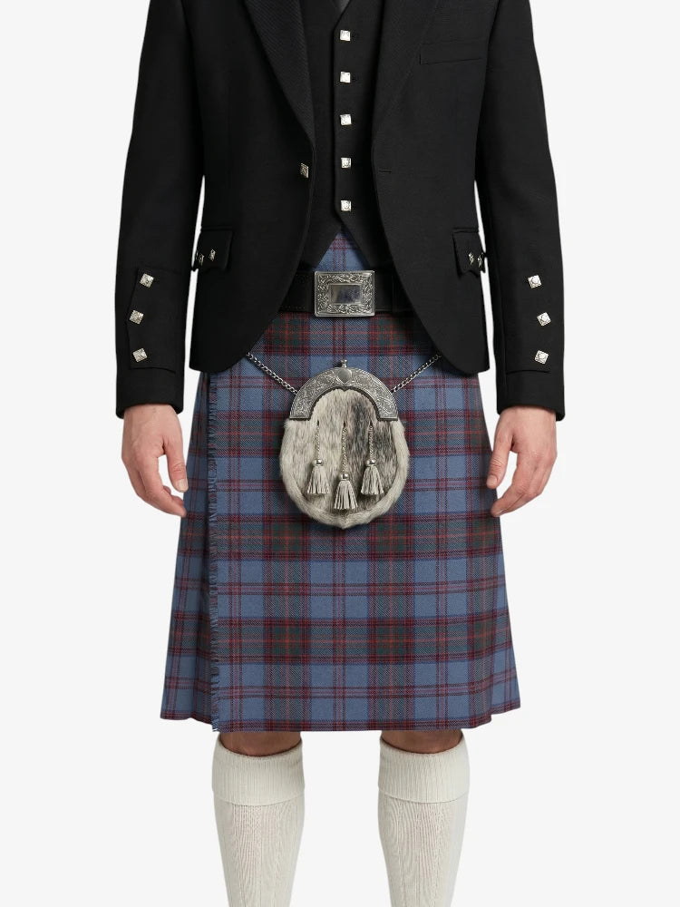 Person wearing a black jacket and blue plaid kilt with a silver sporran on a white background