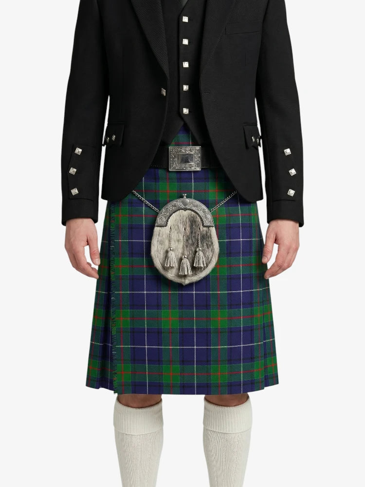 Person wearing a traditional Scottish kilt with a plaid pattern on a white background