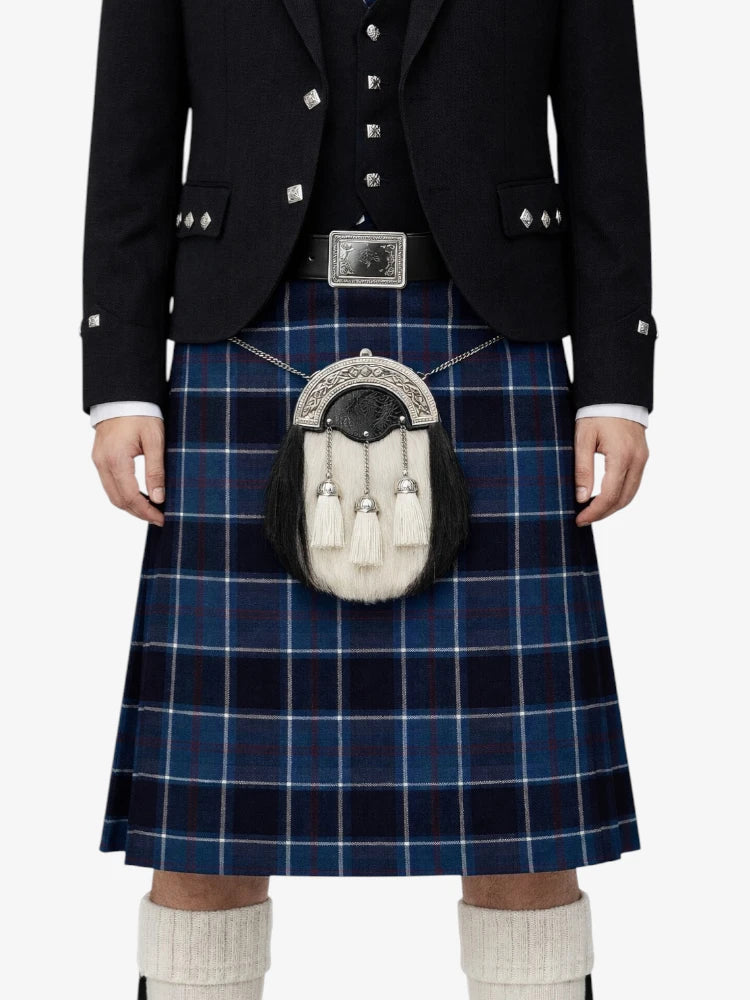Person wearing a traditional Scottish kilt with a sporran on a white background