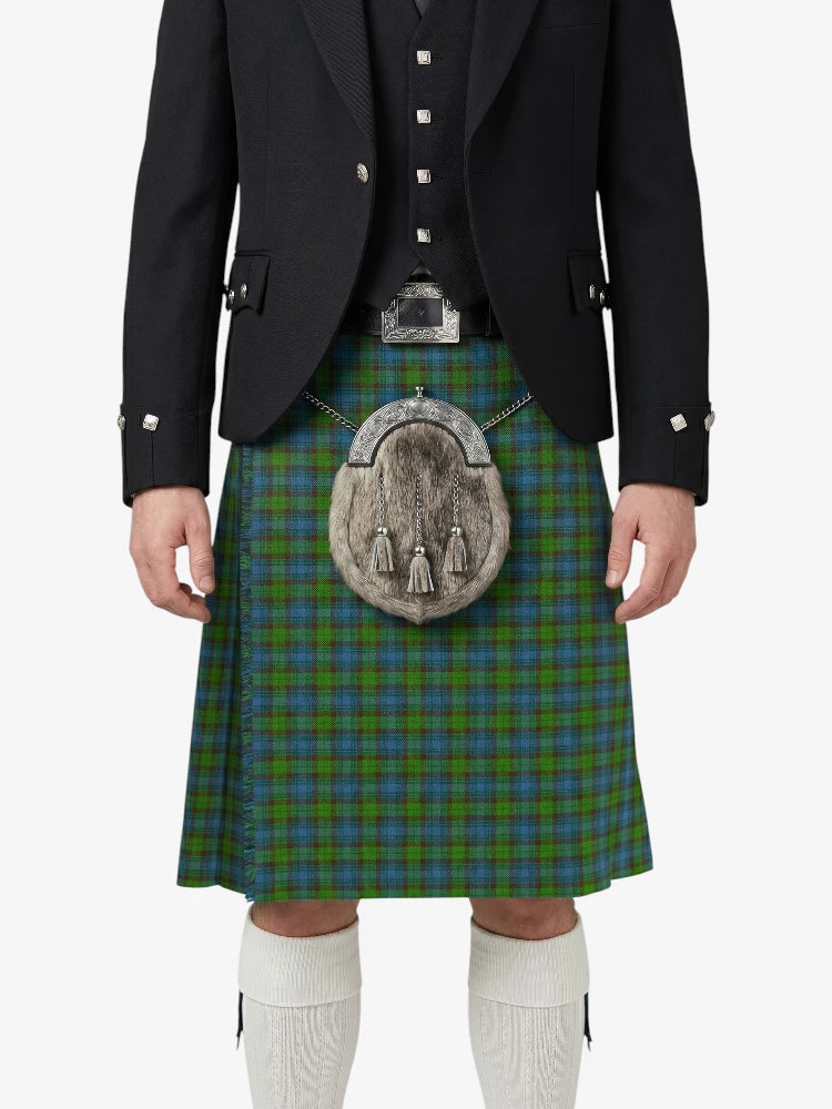 Person wearing a traditional Scottish kilt with a tartan pattern on a white background