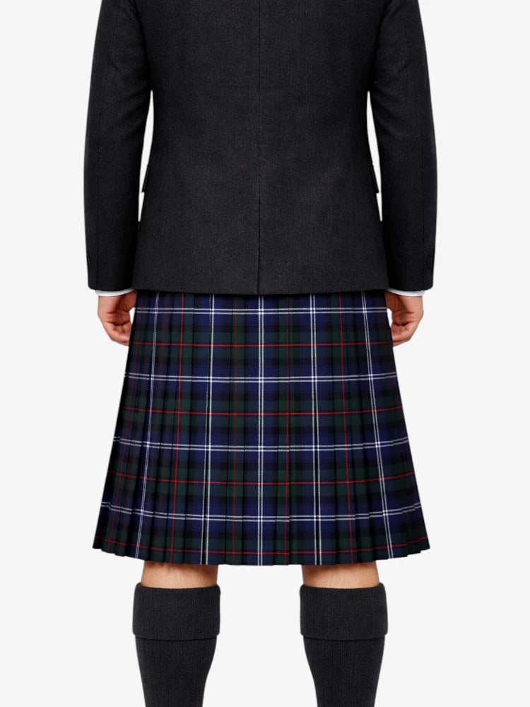 Person wearing a black coat and plaid skirt on a white background