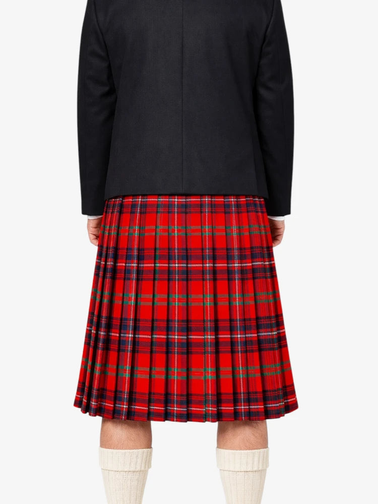 Person wearing a black jacket and red plaid kilt on a white background