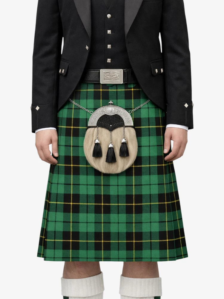 Person wearing a green plaid kilt with a black jacket on a white background