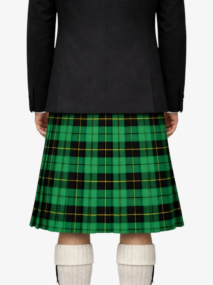 Person wearing a black jacket and green plaid kilt on a white background