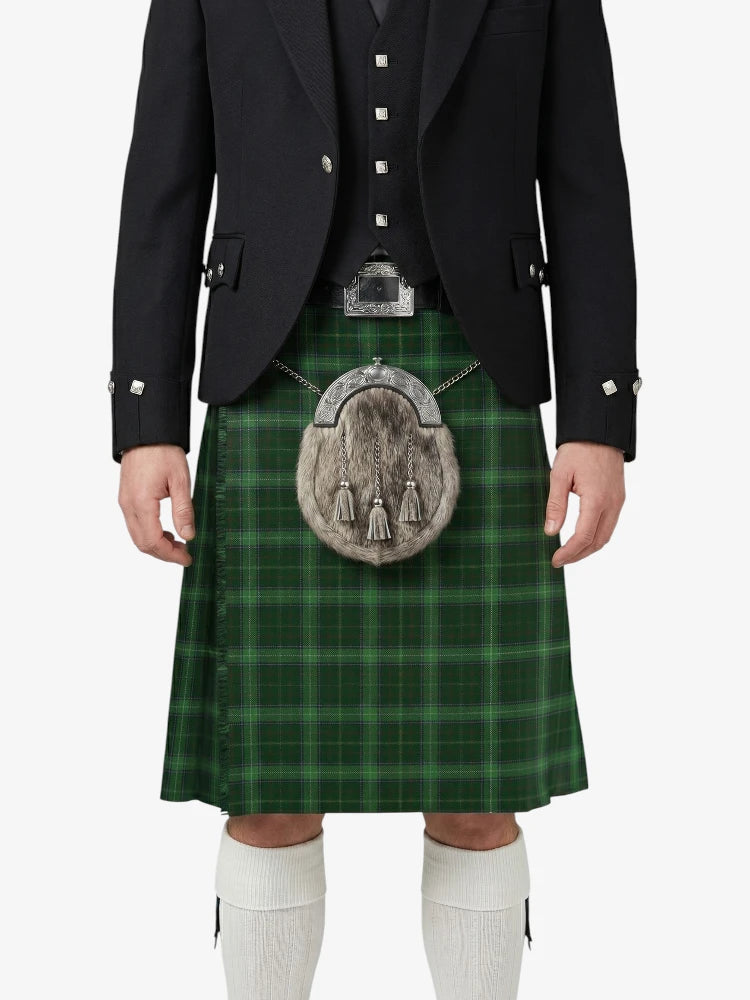 Person wearing a green plaid kilt with a black jacket and white socks on a white background