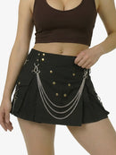 Black skirt with chain details worn by a person on a white background