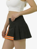 Black pleated skirt with orange accents worn by a person on a white background