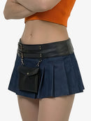 Person wearing a blue pleated skirt with a black waistband and pocket on a white background