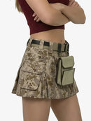 Person wearing a camouflage skirt with multiple pockets and a belt on a white background