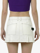 White skirt worn by a person on a white background