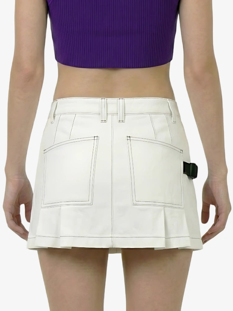 White skirt worn by a person on a white background