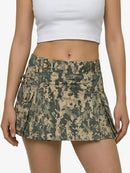 Camouflage skirt worn by a person on a white background