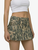 Camouflage skirt worn by a person on a white background