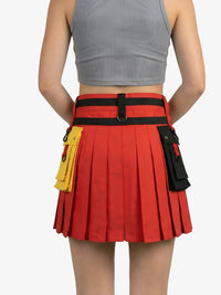 Red pleated skirt with black belt and yellow pouch on a white background