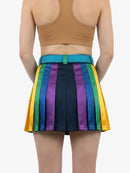 Person wearing a rainbow striped skirt with a plain background