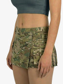 Camouflage skirt worn by a person on a white background