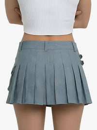 Person wearing a gray pleated skirt on a white background